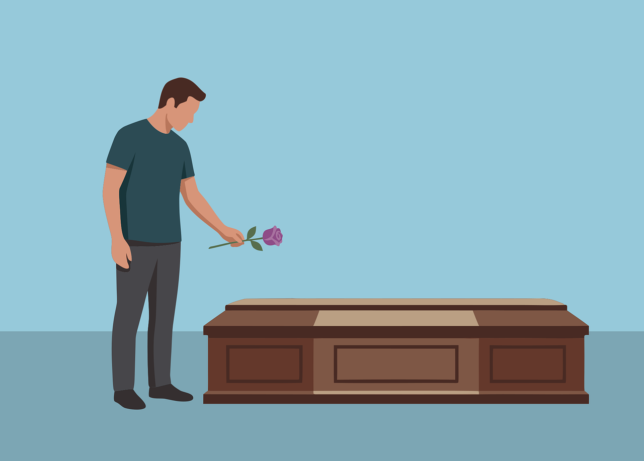 お棺に花をたむむける男性のイラスト