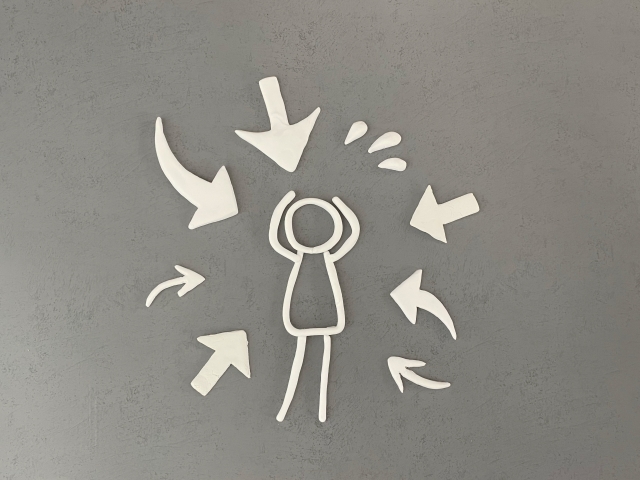 プレッシャーを受けている棒人間